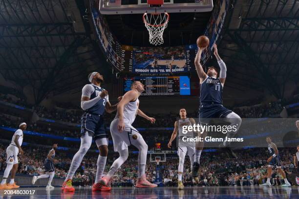 Luka Doncic of the Dallas Mavericks drives to the basket during the game against the Denver Nuggets on March 17, 2024 at the American Airlines Center...