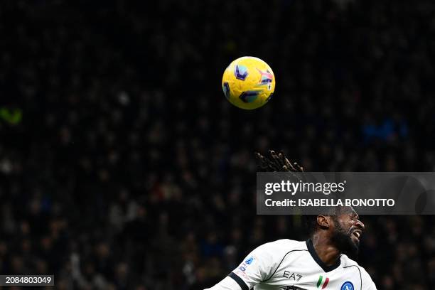 Napoli's Cameroon midfielder Andre Zambo Anguissa heads the ball during the Serie A football match between Inter Milan and Napoli at San Siro stadium...