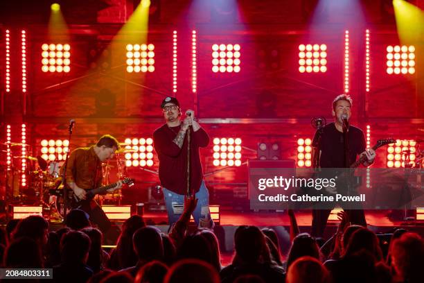 Ryan Peake of Nickelback, HARDY, and Chad Kroeger of Nickelback perform at CMT Crossroads: Nickelback & HARDY at Marathon Music Works on March 07,...