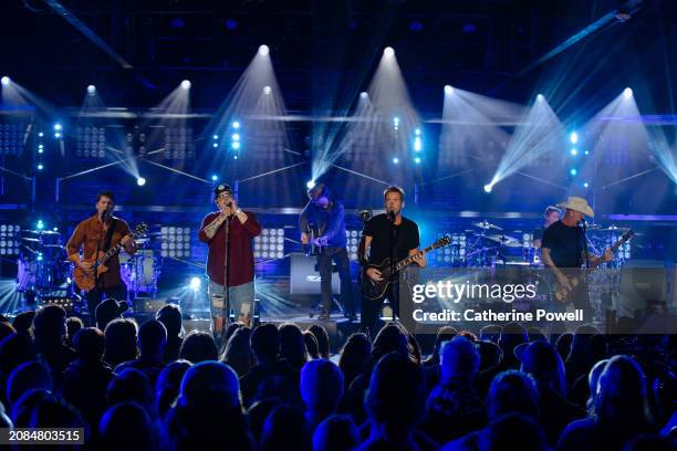 Ryan Peake of Nickelback, HARDY, and Chad Kroeger and Mike Kroeger of Nickelback perform at CMT Crossroads: Nickelback & HARDY at Marathon Music...