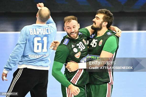 Hungary's team players celebrate the victory over Portugal and the ticket to Paris 2024 after the men's Handball Olympic qualifying match between...