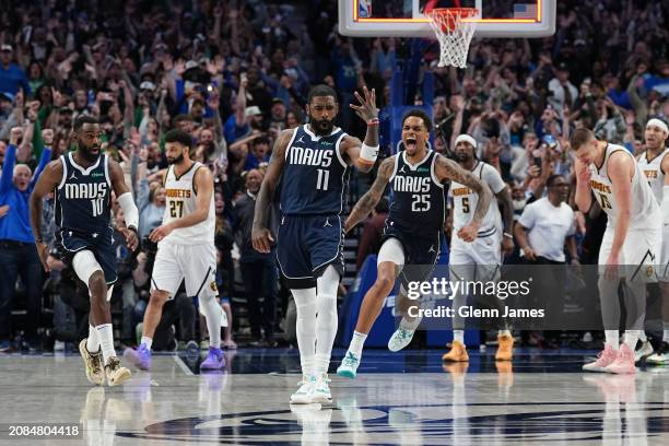 Kyrie Irving of the Dallas Mavericks celebrates during the game after scoring the game winning basket against the Denver Nuggets on March 17, 2024 at...