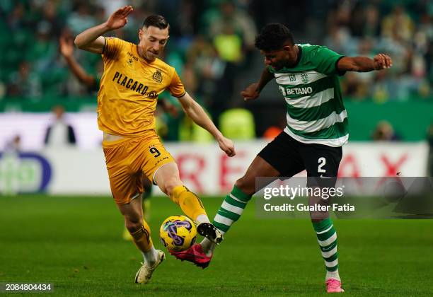Robert Bozenik of Boavista FC with Matheus Reis of Sporting CP in action during the Liga Portugal Betclic match between Sporting CP and Boavista FC...