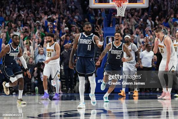 Kyrie Irving of the Dallas Mavericks celebrates during the game after scoring the game winning basket against the Denver Nuggets on March 17, 2024 at...