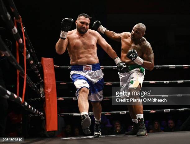 Mayo , Ireland - 17 March 2024; Dillian Whyte, right, in action against Christian Hammer during their heavy weight bout at TF Royal Theatre in...