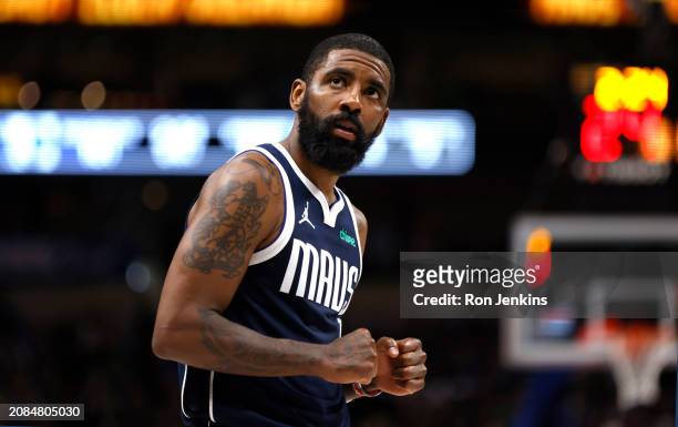Kyrie Irving of the Dallas Mavericks reacts late in the game against the Denver Nuggets in the second half at American Airlines Center on March 17,...