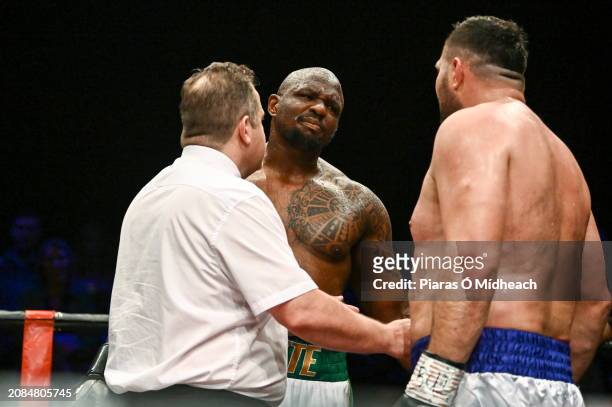 Mayo , Ireland - 17 March 2024; Dillian Whyte in conversation with Christian Hammer, right, after their heavy weight bout was stopped by Hammer's...