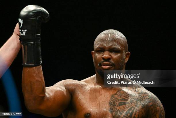 Mayo , Ireland - 17 March 2024; Dillian Whyte has his arm lifted in victory after his heavy weight bout against Christian Hammer was stopped by...