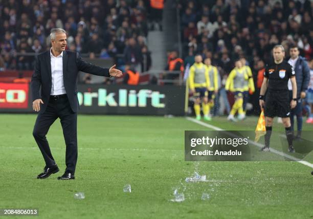 Head Coach of Fenerbahce Ismail Kartal is seen as objects are threw on the pitch, during the Turkish Super Lig week 30 football match between...