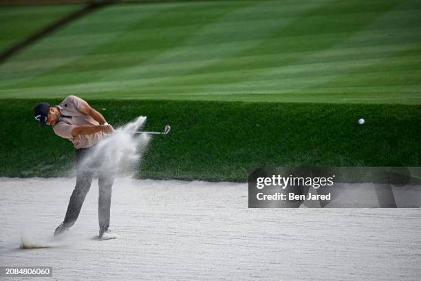 Xander Schauffele plays a shot from a bunker on the 15th hole during the final round of THE PLAYERS Championship at Stadium Course at TPC Sawgrass on...