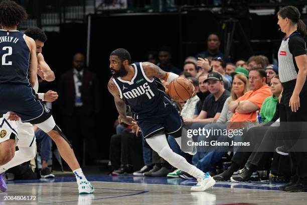 Kyrie Irving of the Dallas Mavericks handles the ball during the game against the Denver Nuggets on March 17, 2024 at the American Airlines Center in...