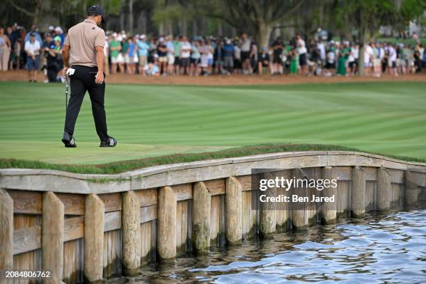 Xander Schauffele walks up to the 18th green during the final round of THE PLAYERS Championship at Stadium Course at TPC Sawgrass on March 17, 2024...