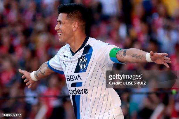 Monterrey's Argentine midfielder Maximiliano Meza celebrates after scoring during the Mexican Clausura tournament football match between Atlas and...