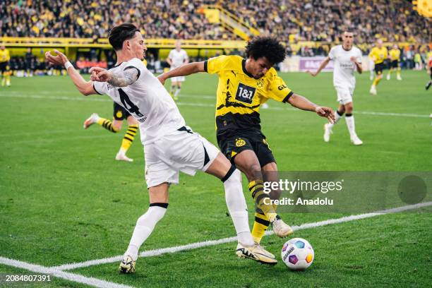 Karim Adeyemi of Borussia Dortmund and Robin Koch of Eintracht Frankfurt in action during the Bundesliga football match between Borussia Dortmund and...