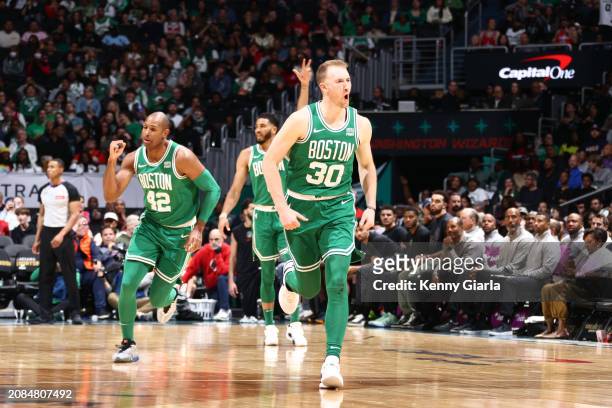 Sam Hauser of the Boston Celtics celebrates during the game against the Washington Wizards on March 17, 2024 at Capital One Arena in Washington, DC....