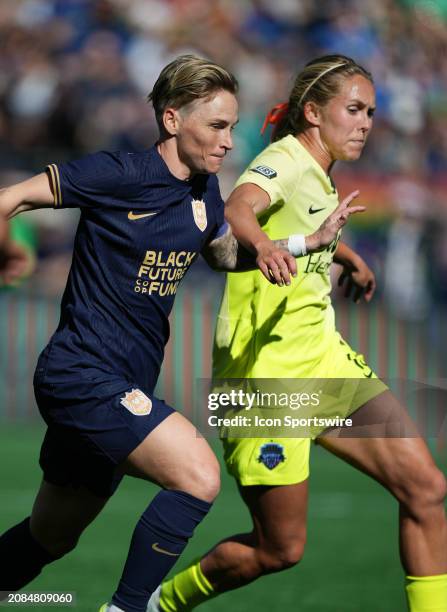 Seattle Reign midfielder Jess Fishlock and Washington Spirit midfielder Brittany Ratcliffe battle for position during a NWSL game between the Seattle...