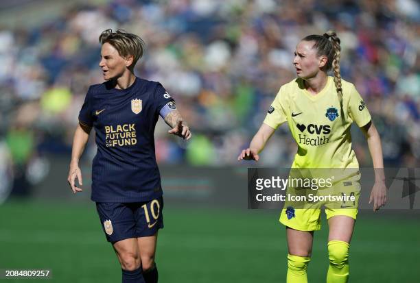 Seattle Reign midfielder Jess Fishlock and Washington Spirit defender Gabby Carle look on during a NWSL game between the Seattle Reign FC and the...