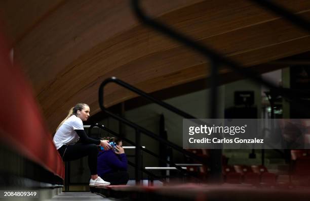 McKenzie Schmidt of the Elmira College Soaring Eagles sits in the empty arena before fans were let in at the Division III Women's Ice Hockey...
