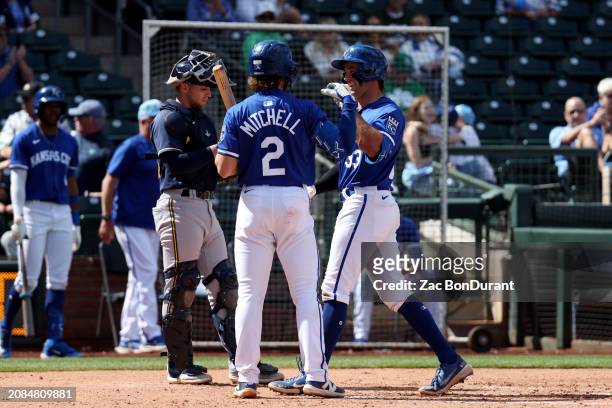 Trevor Werner of the Kansas City Royals is greeted by teammate Blake Mitchell after hitting a solo home run in the fourth inning during the 2024...