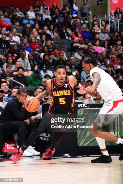 Dejounte Murray of the Atlanta Hawks drives to the basket during the game against the LA Clippers on March 17, 2024 at Crypto.Com Arena in Los...