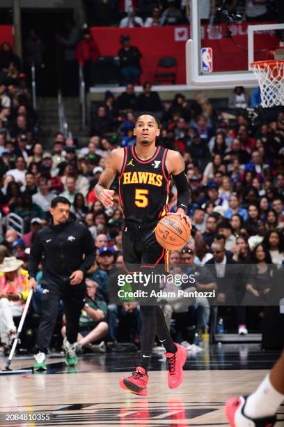 Dejounte Murray of the Atlanta Hawks dribbles the ball during the game against the LA Clippers on March 17, 2024 at Crypto.Com Arena in Los Angeles,...