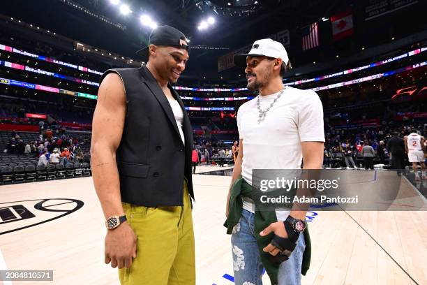 Russell Westbrook of the LA Clippers talks to Trae Young of the Atlanta Hawks after the game on March 17, 2024 at Crypto.Com Arena in Los Angeles,...