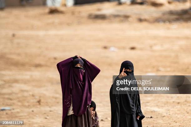 Children gesture to the camera at the al-Hol camp in Syria's northeastern Al-Hasakah Governorate, on October 11, 2023. The al-Hol camp is the largest...