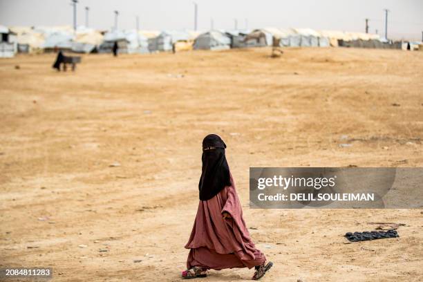 Girl walks through an open area at the al-Hol camp in Syria's northeastern Al-Hasakah Governorate, on October 11, 2023. The al-Hol camp is the...