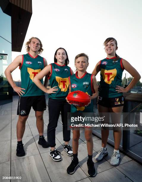 Oliver Kelly, Taya Parker, Jimi Partridge and Caitlin Evans pose during the Tasmania Football Club Launch at Paranaple Convention Centre on March 18,...