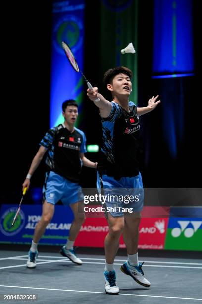 Liu Yuchen and Ou Xuanyi of China compete in the Men's Doubles Second Round match against Lee Yang and Wang Chi-Lin of Chinese Taipei during day...