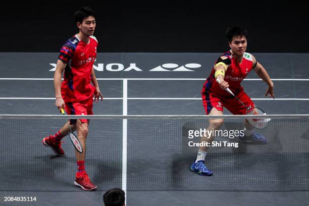 Liang Weikeng and Wang Chang of China compete in the Men's Doubles Second Round match against Lee Yang and Wang Chi-Lin of Chinese Taipei during day...