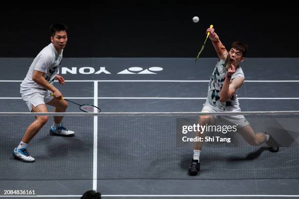 Lee Yang and Wang Chi-Lin of Chinese Taipei compete in the Men's Doubles Second Round match against Liang Weikeng and Wang Chang of China during day...