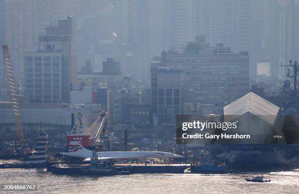 Retired British Airways Concorde supersonic airplane arrives at the Intrepid Museum after being reconditioned in New York City on March 14 as seen...