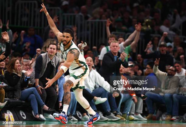 Jayson Tatum of the Boston Celtics celebrates after hitting a three point shot against the Phoenix Suns during the second quarter at TD Garden on...