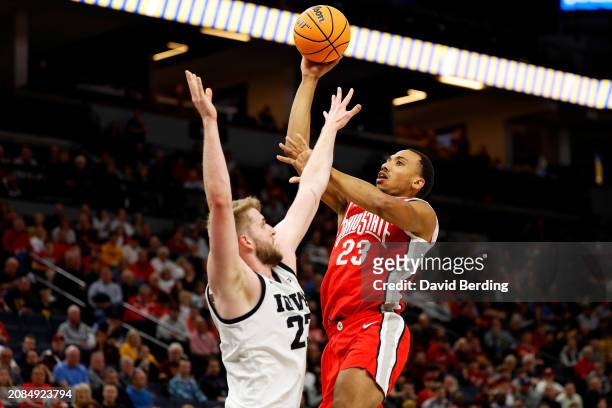 Zed Key of the Ohio State Buckeyes shoots the ball against Ben Krikke of the Iowa Hawkeyes in the second half in the Second Round of the Big Ten...