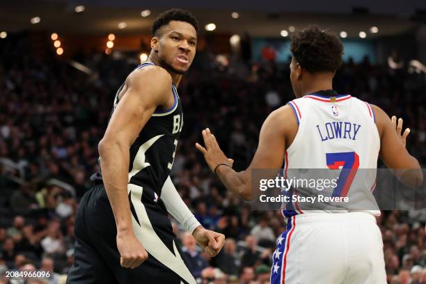 Giannis Antetokounmpo of the Milwaukee Bucks reacts to a dunk during the first half of a game against the Philadelphia 76ers at Fiserv Forum on March...