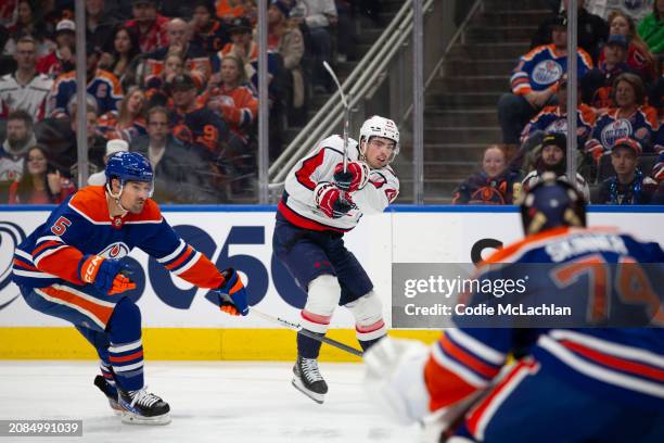 Hendrix Lapierre of the Washington Capitals takes a shot against goaltender Stuart Skinner of the Edmonton Oilers during the first period at Rogers...