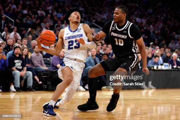 Trey Alexander of the Creighton Bluejays dribbles against Rich Barron of the Providence Friars in the second half during the Quarterfinals of the Big...