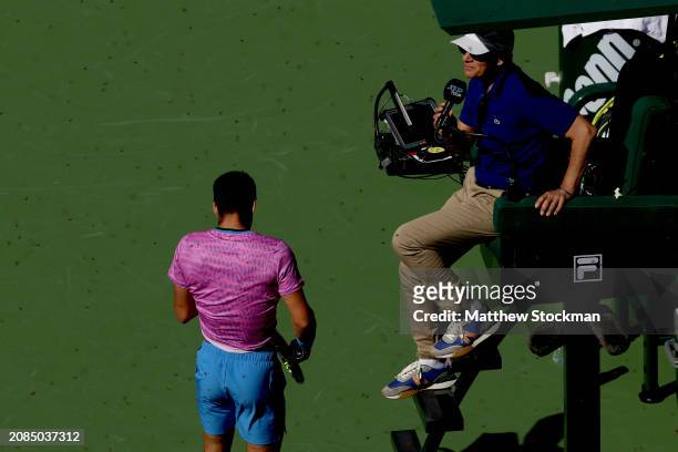 Chair umpire Mohamed Lahyani suspends play as Carlos Alcaraz of Spain leaves the court after an invasion of bees suspends his match against Alexander...
