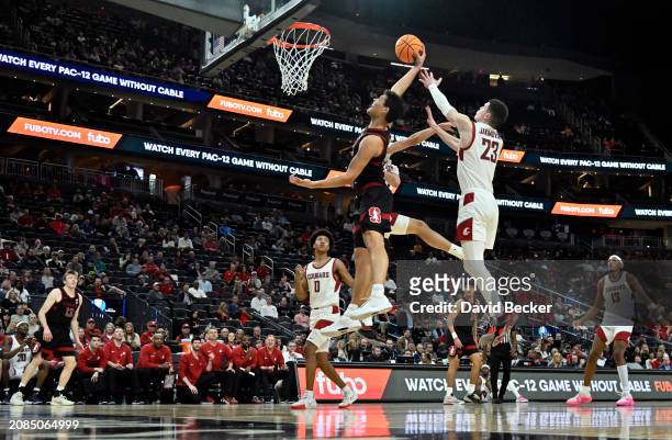 Brandon Angel of the Stanford Cardinal shoots against Andrej Jakimovski of the Washington State Cougars in the first half of a quarterfinal game of...
