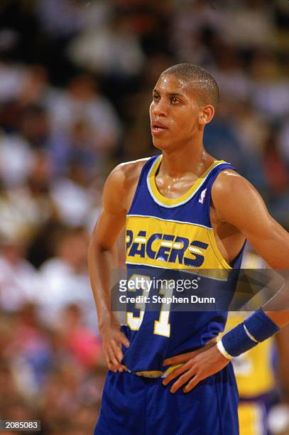 Reggie Miller of the Indiana Pacers looks on against the Los Angeles Lakers during the game at the Great Western Forum in Inglewood, California.