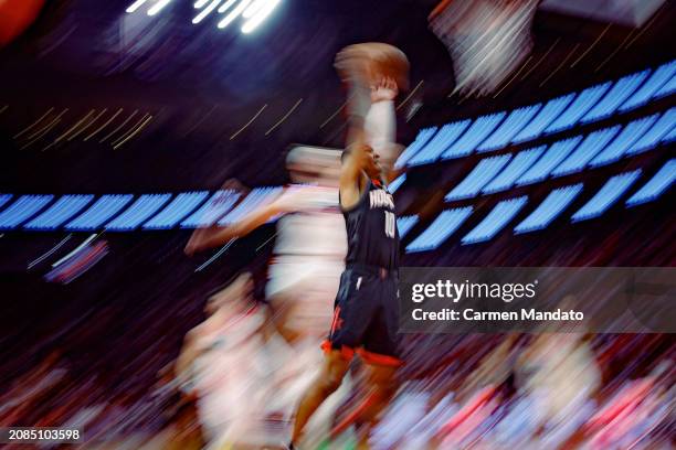 Jabari Smith Jr. #10 of the Houston Rockets drives to the basket against the Washington Wizards during the second half at Toyota Center on March 14,...