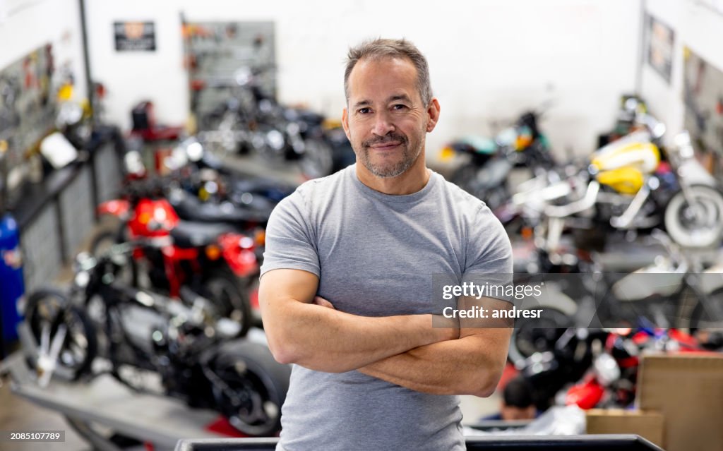 Portrait of a mechanic owning a motorcycle garage