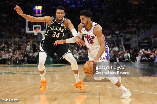 Tobias Harris of the Philadelphia 76ers drives to the basket against Giannis Antetokounmpo of the Milwaukee Bucks during the second half of a game at...