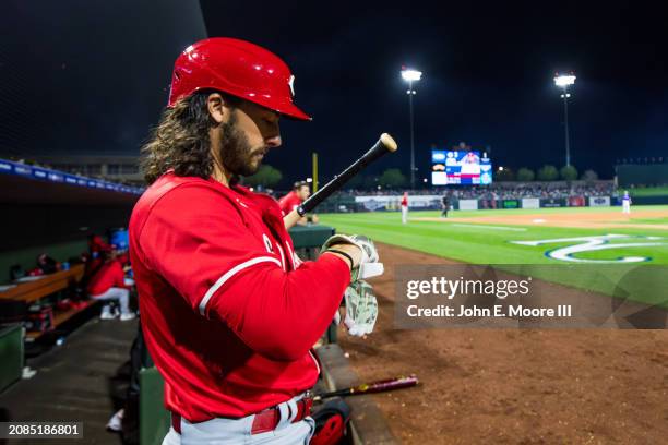 Jonathan India of the Cincinnati Reds stands in the dugout during the Spring Training Game against the Texas Rangers at Surprise Stadium on March 14,...