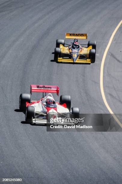 Danny Sullivan of the USA and Team Penske, followed by Bobby Rahal, competes in the CART PPG Indy Car World Series Autoworks 200 on April 8, 1990 at...