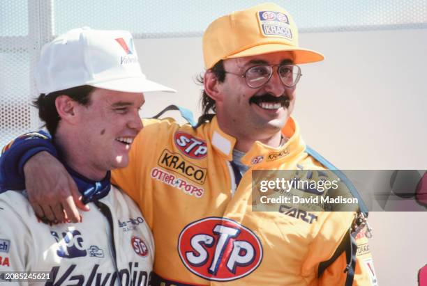 Al Unser Jr of the USA and teammate Bobby Rahal of the USA and Galles-Kraco Racing celebrate their third and second place finishes in the CART PPG...