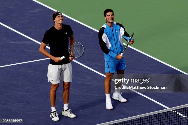 Alexander Zverev of Germany and Carlos Alcaraz of Spain watch as bees are removed from the stadium during the BNP Paribas Open at Indian Wells Tennis...