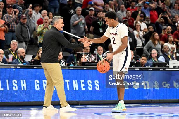 Head coach Tony Bennett and Reece Beekman of the Virginia Cavaliers celebrate after a 66-60 victory against the Boston College Eagles in the...