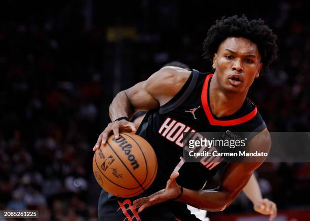 Amen Thompson of the Houston Rockets in action against the Washington Wizards during the second half at Toyota Center on March 14, 2024 in Houston,...